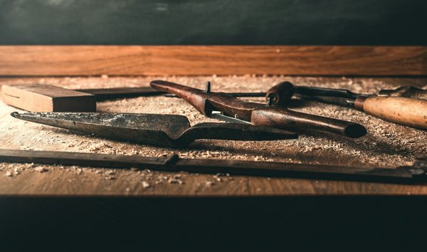 How can tourists participate in detailed workshops on traditional British carpentry techniques?